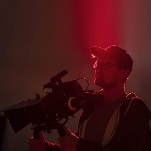 man-filming-with-professional-camera